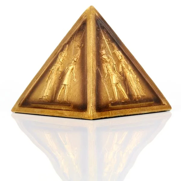 Gold Egyptian pyramid ornament made of resin, made in China, showing a stylised pyramid shape in a decorative design.