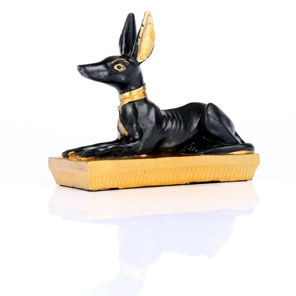 Gold Egyptian Anubis figurine in resin, black detailing, depicts jackal head on stand