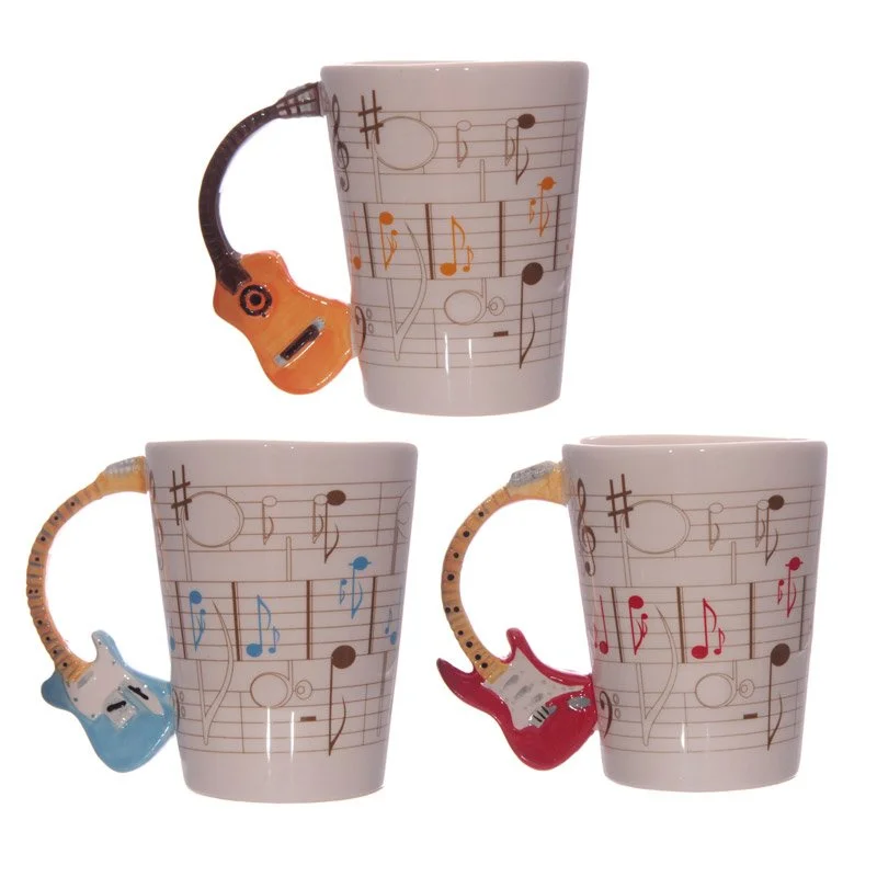 Ceramic guitar mug featuring sheet music decal, shaped handle, 280ml, food safe, made in China.