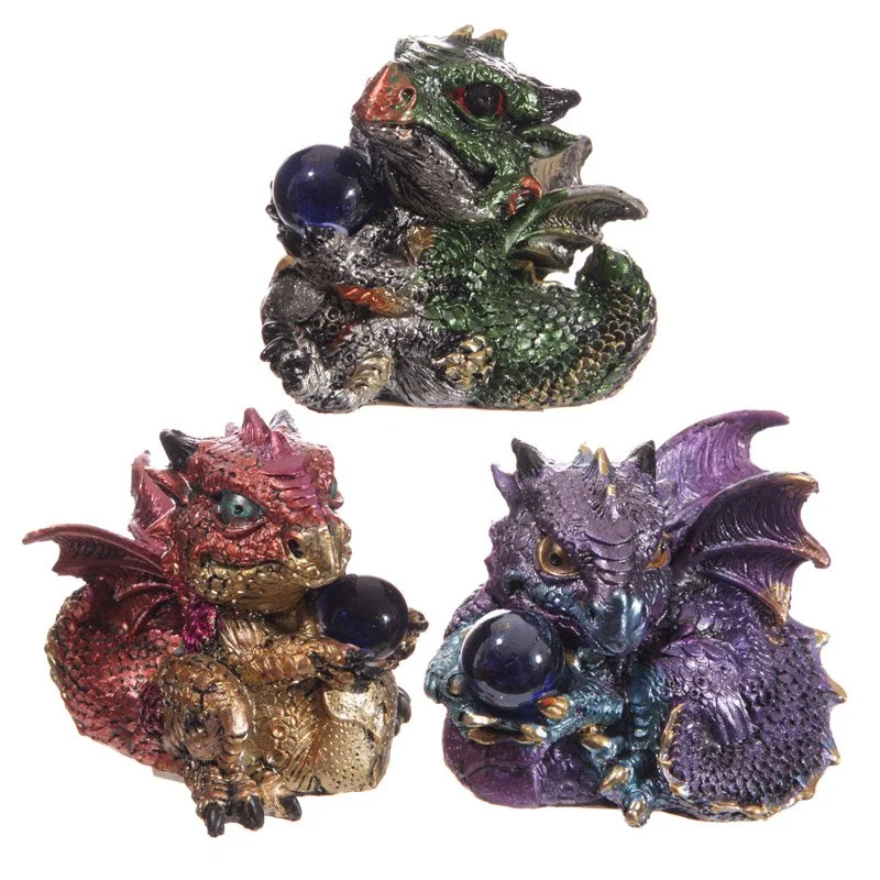 Cute resin baby dragon figurine in a clear crystal ball