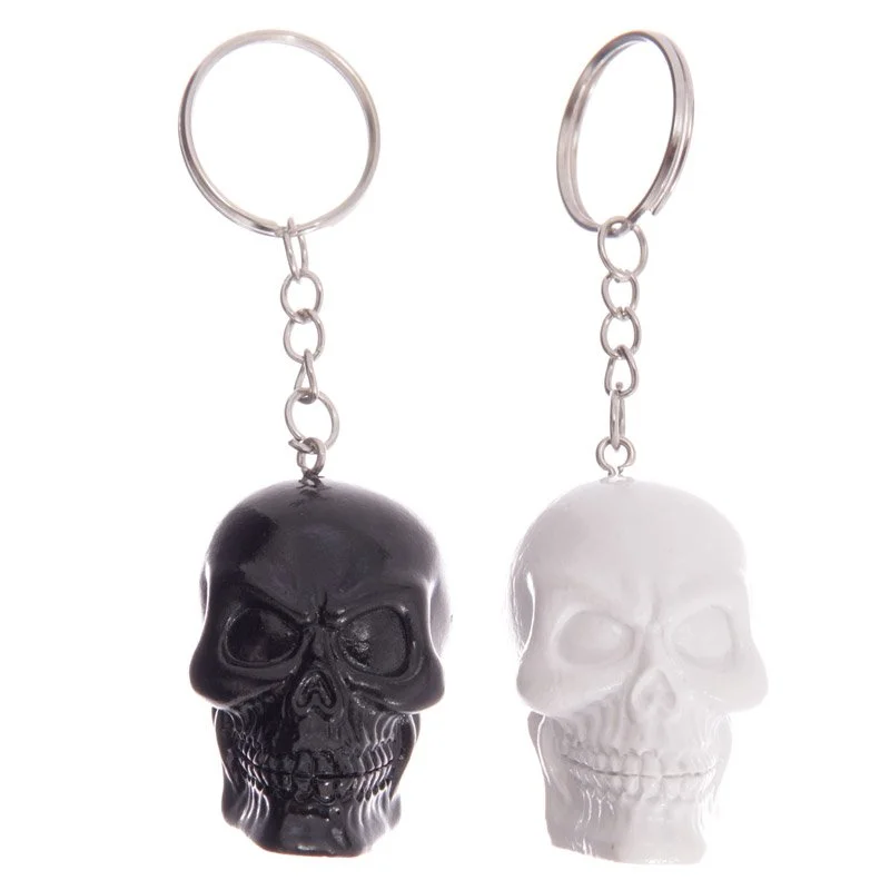 Black and white skull keyring made from resin and metal.