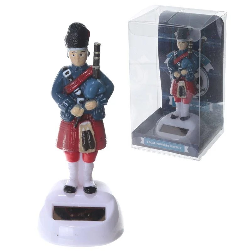 Solar piper garden ornament: plastic ABS pipe player with metal coppered instrument set, CE marked, decorative.