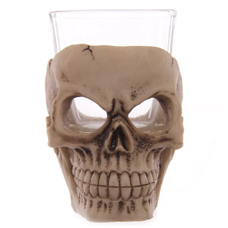 Glossy resin and glass skull shot glass with detailed bone texture, perfect for Halloween themed drinks.