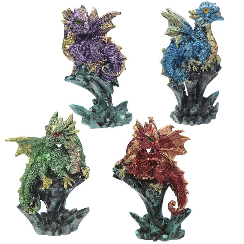 Resin dragon figurine with crystal wings, perched on stone, giving an enchanting nightmare look.