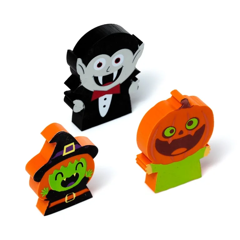 A witch eraser, vampire eraser and pumpkin eraser in a three‑piece rubber set.