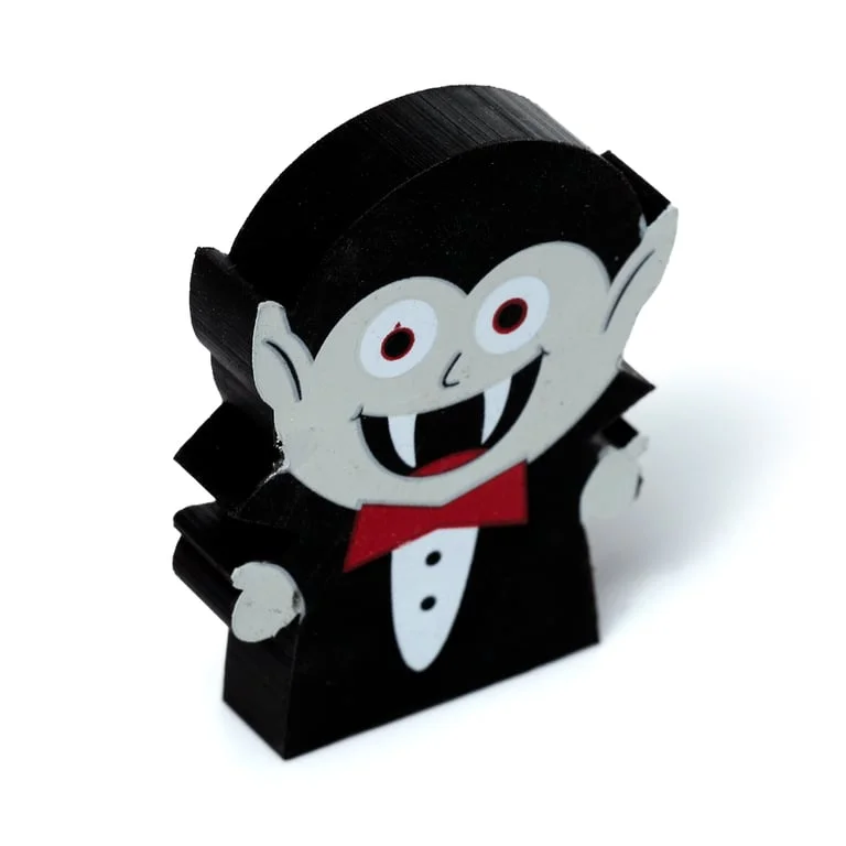 Three‑piece rubber eraser set with witch, vampire and pumpkin patterns displayed together.