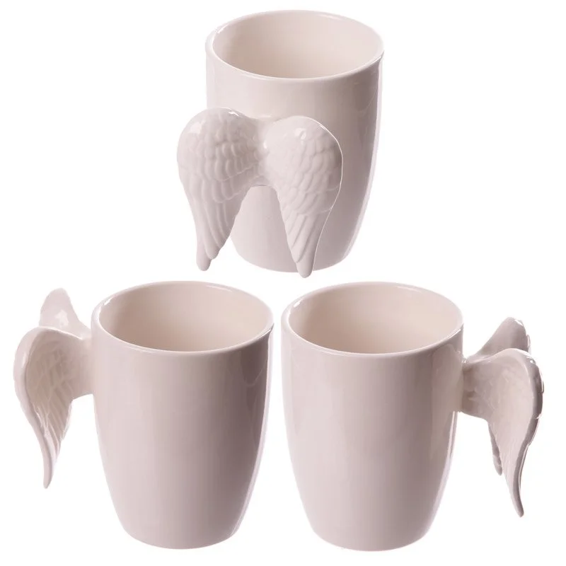 White ceramic angel wing mug showing wing-shaped handle design