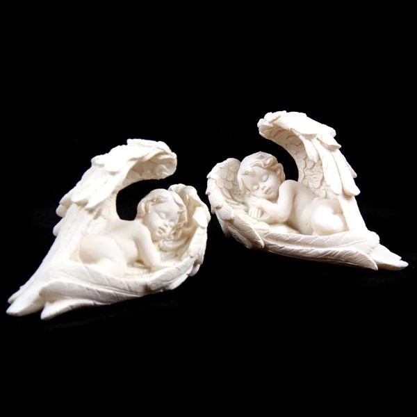 Sleeping cherub figurine in resin, lying on side, made in China