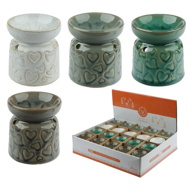 Heart-shaped mini ceramic oil burner made of dolomite ceramic, featuring a shallow dish for a tea light.