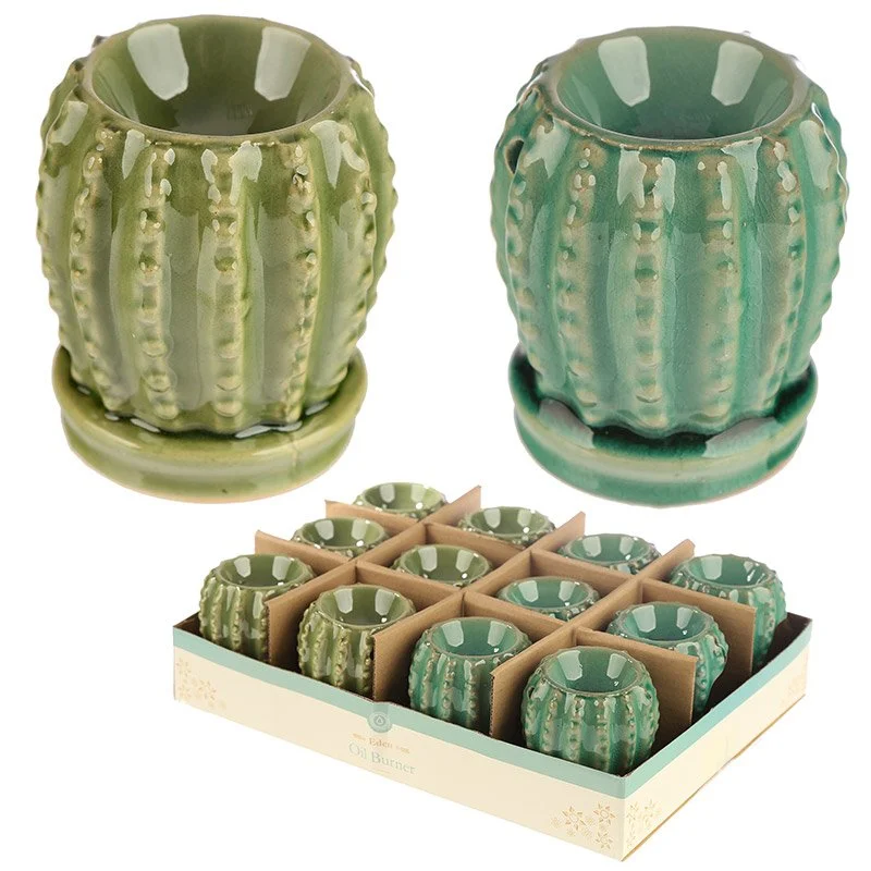 Mini dolomite ceramic oil burner shaped like a cactus, chipped green glaze, set on a flat surface