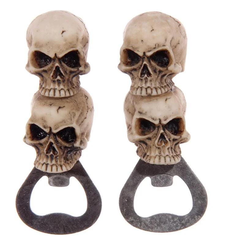 Double skull bottle opener with resin and metal construction, showcasing two skulls affixed to a metal handle, non‑magnetic
