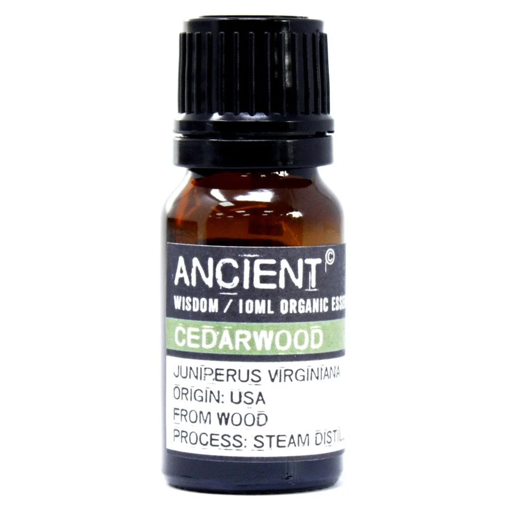 Transparent amber glass bottle of organic cedarwood essential oil, 10ml, labelled with brand name.
