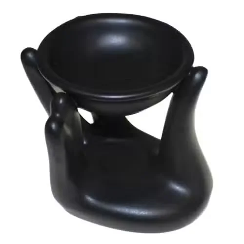 Black Helping Hand decorative oil burner, sleek and stylish metal design.