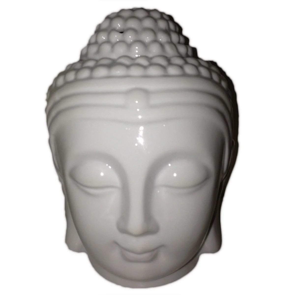 White Buddha oil burner on stone base, subtle incense flame.