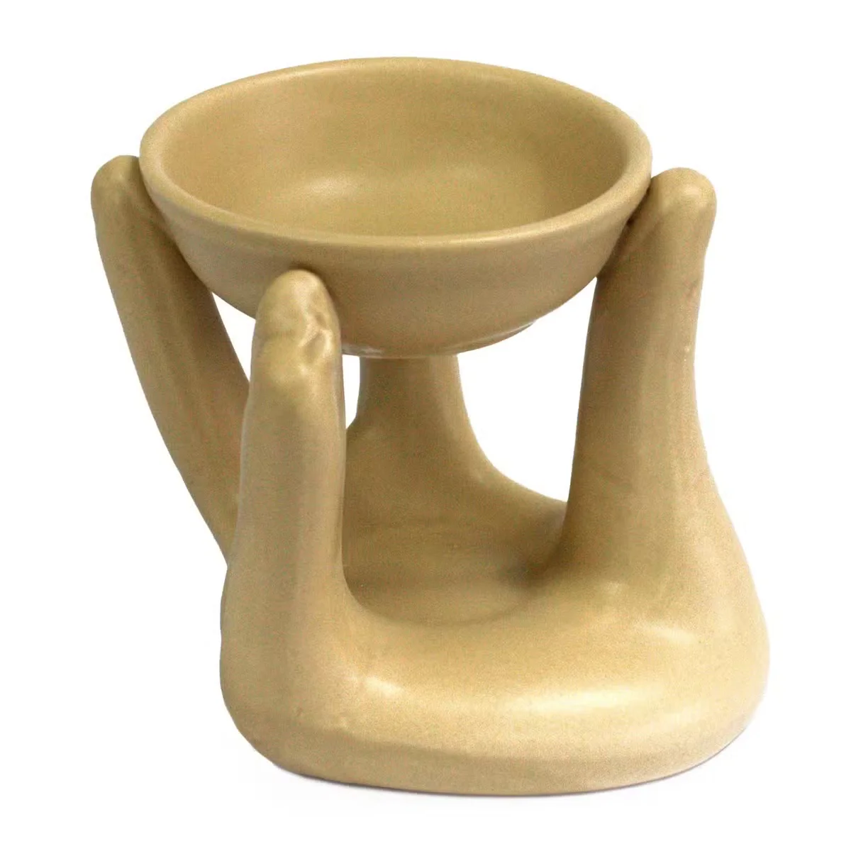 Tan decorative oil burner with open hand design.