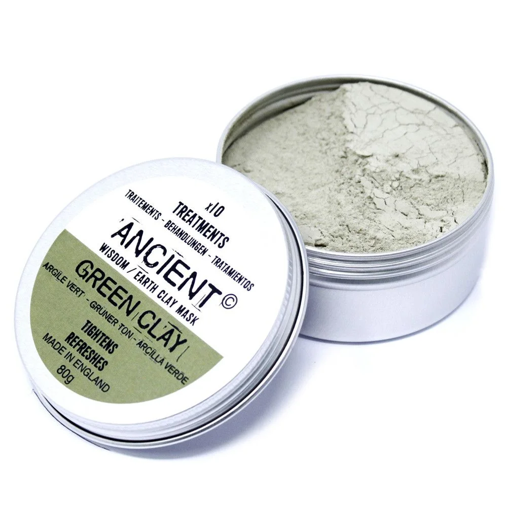 Sachet of green clay face mask in compact packaging with a green label.