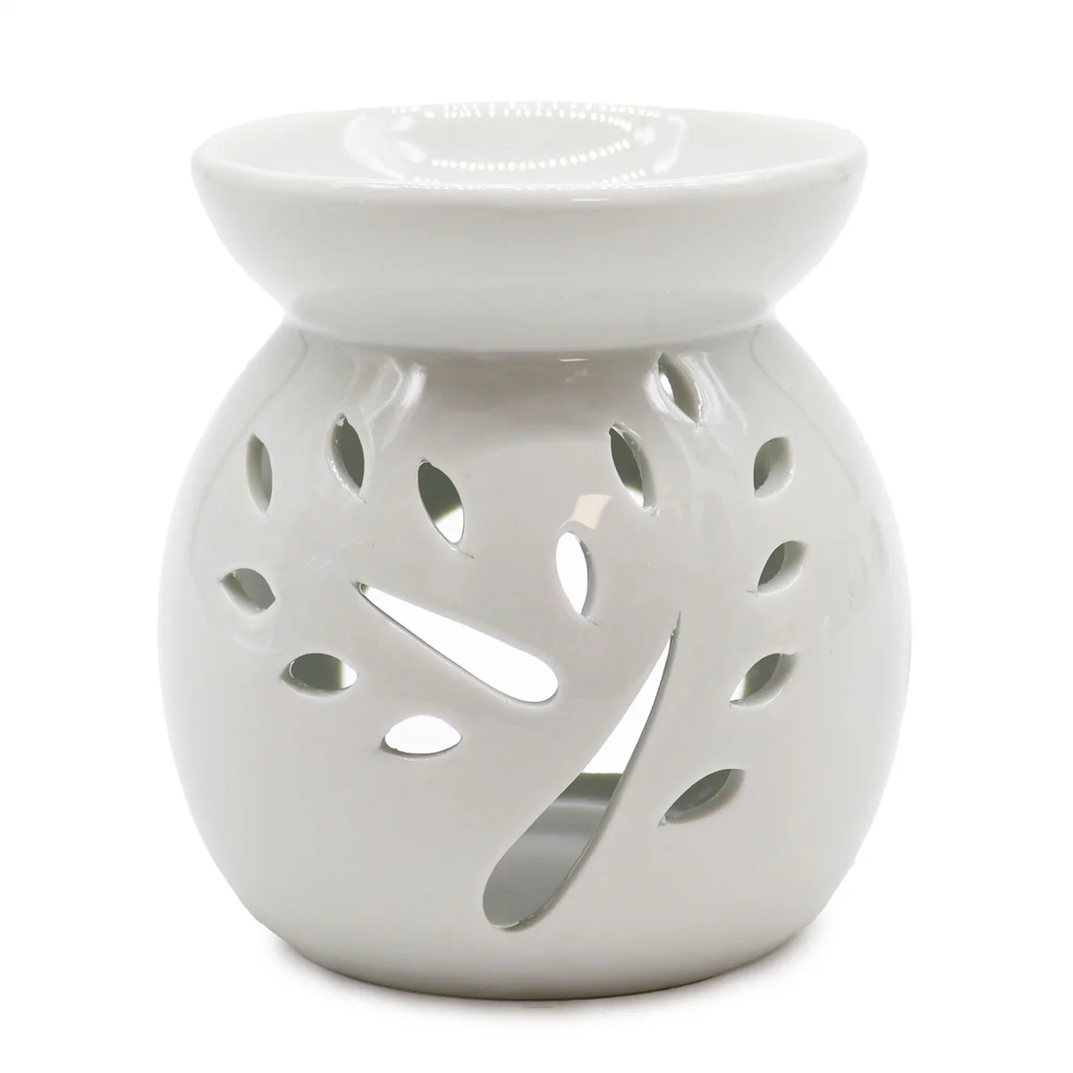 Large white oil burner with tree cut‑out, classic design.