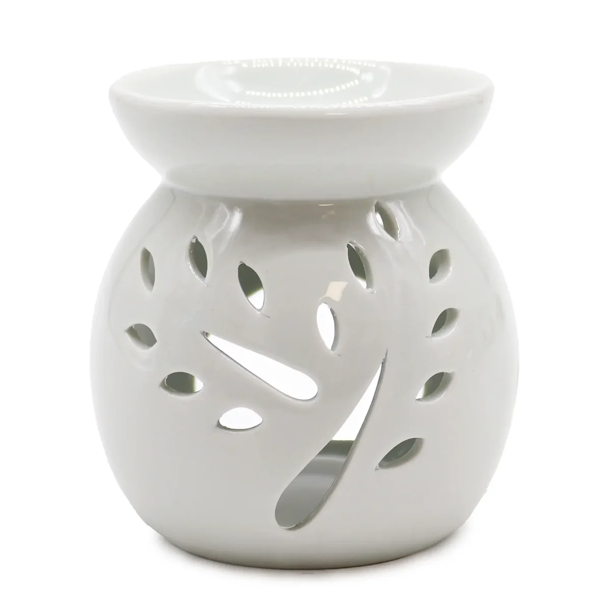 White oil burner with tree cut‑out design.