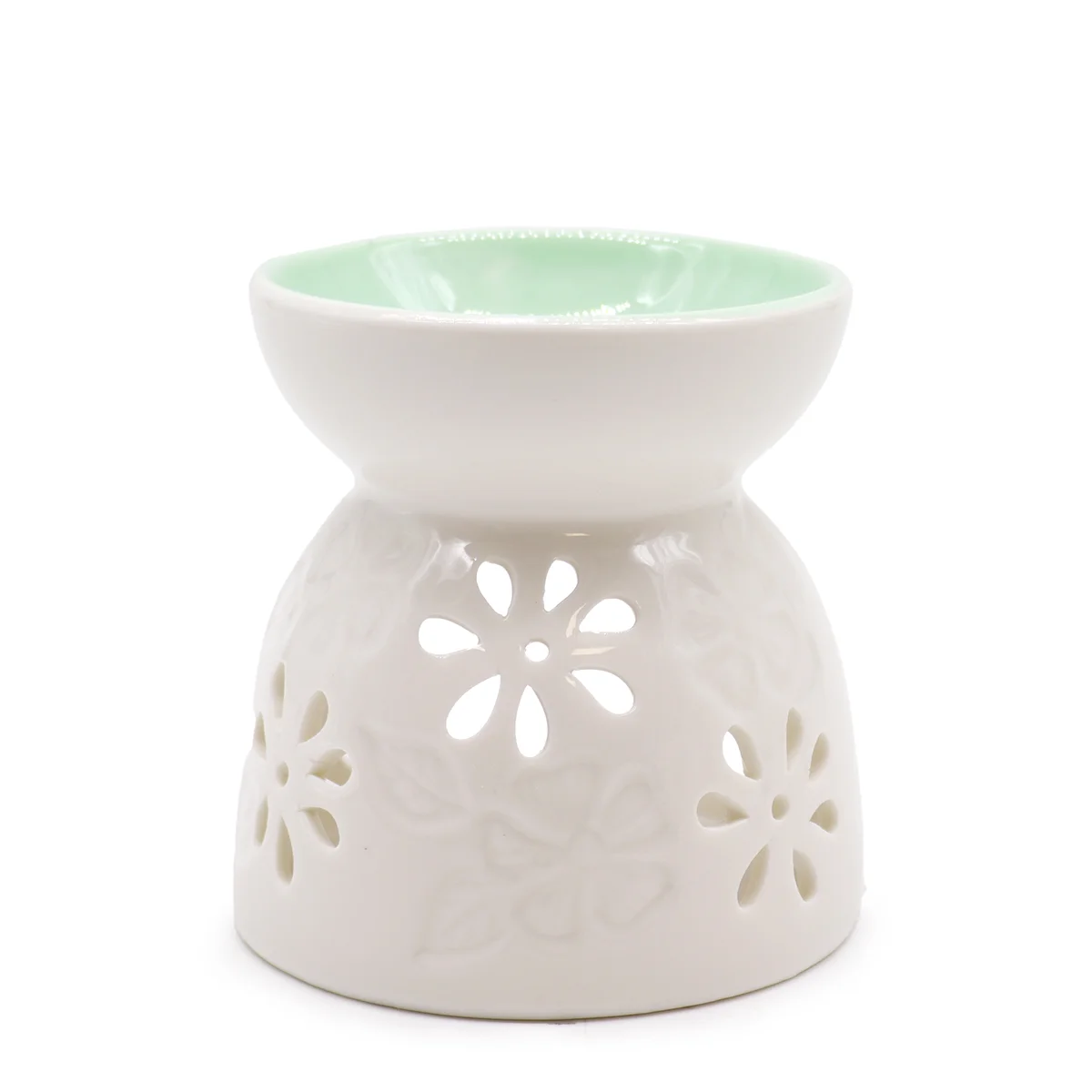 Classic white oil burner with floral pattern and a teal oil burner detail.