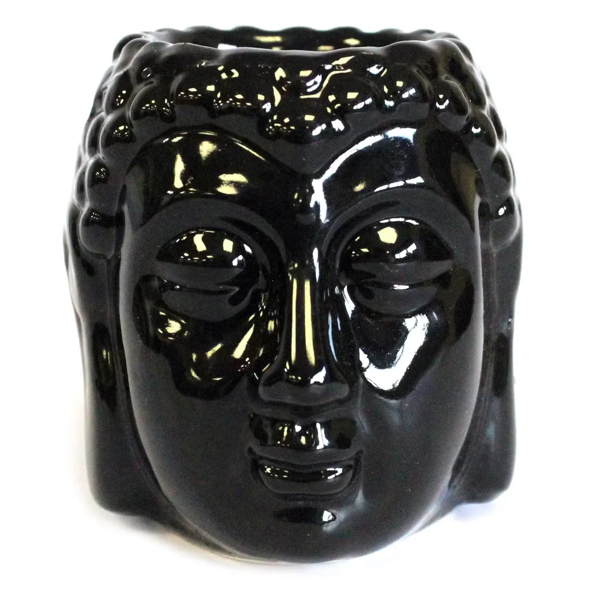 Black Buddha essential oil burner with a simple silhouette, ceramic base, and a hanging loop, set on wood.