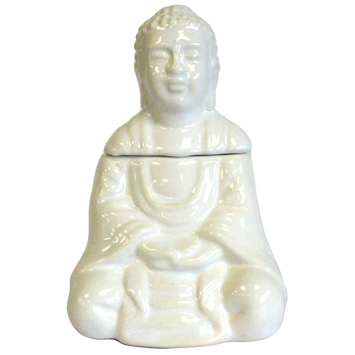 White Buddha oil burner positioned on a flat surface, showing its serene design with seated Buddha silhouette.