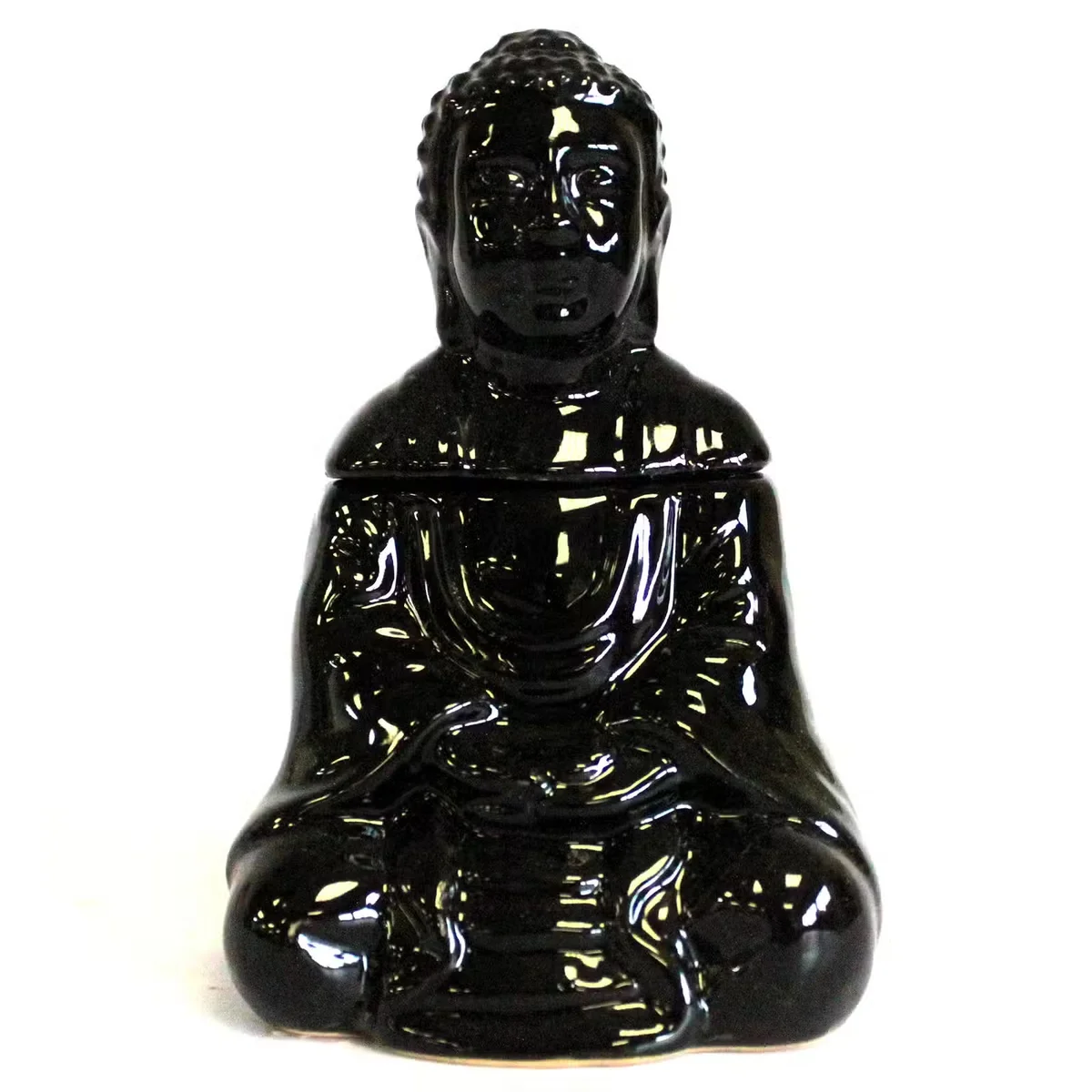 Black sitting Buddha oil burner on a flat surface.
