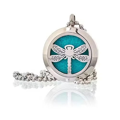 Diffuser necklace with a 25mm dragonfly charm, visible on a clear pendant loop.