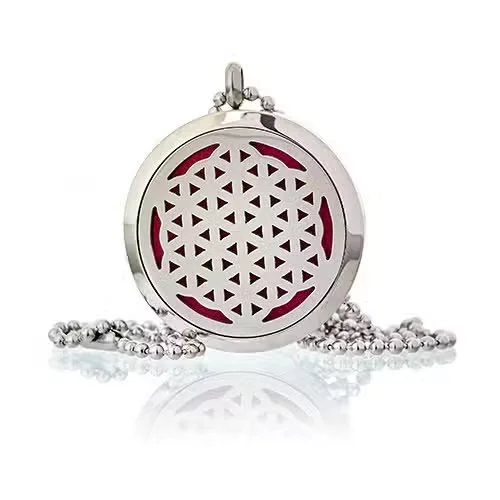 A 30mm diffuser necklace with a Flower of Life design, worn as a pendant.