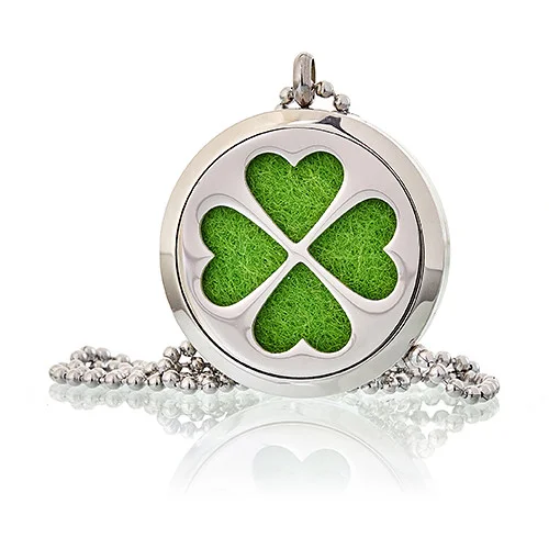 Four leaf clover 30mm aromatherapy necklace displayed on a stand