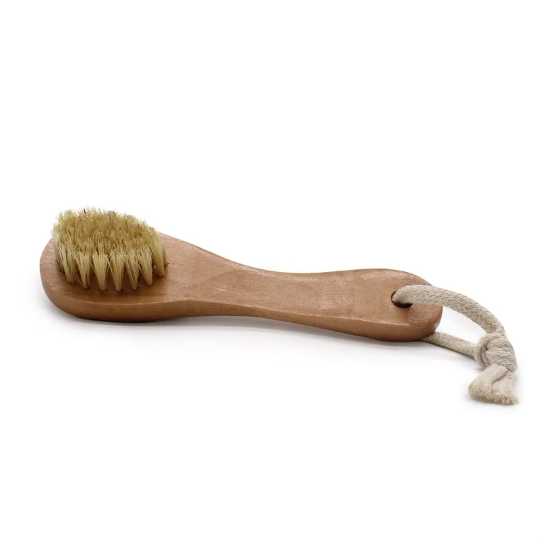 Serious scrub face brush with soft bristles in a sleek design for gentle facial cleansing