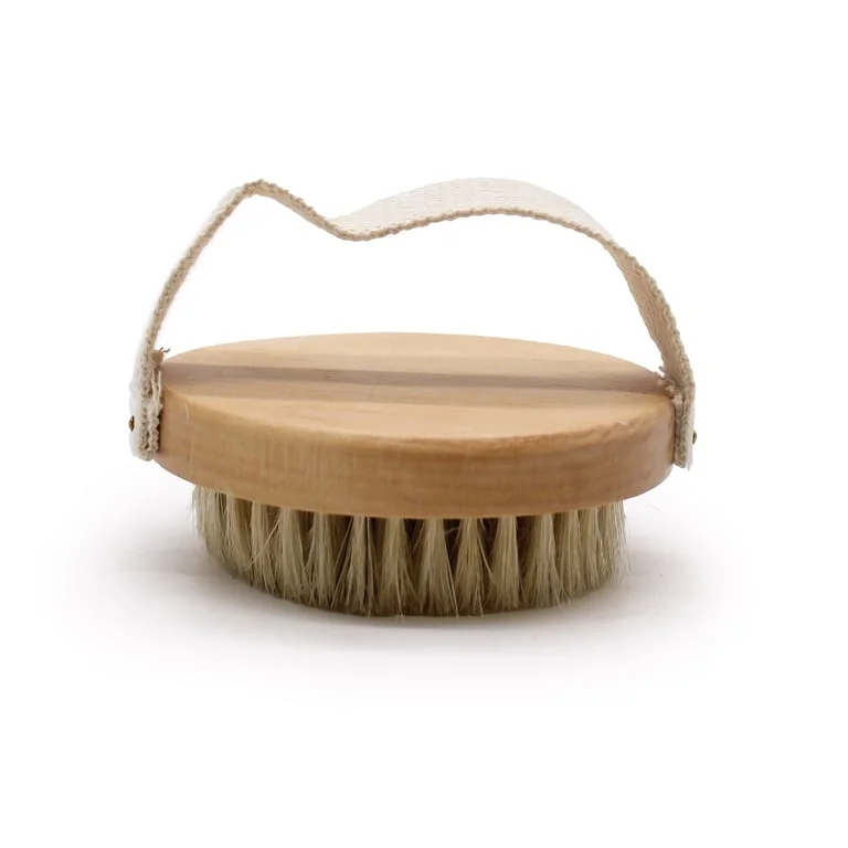 Hand Grip Serious body scrub brush shown with textured bristles and ergonomic handle.