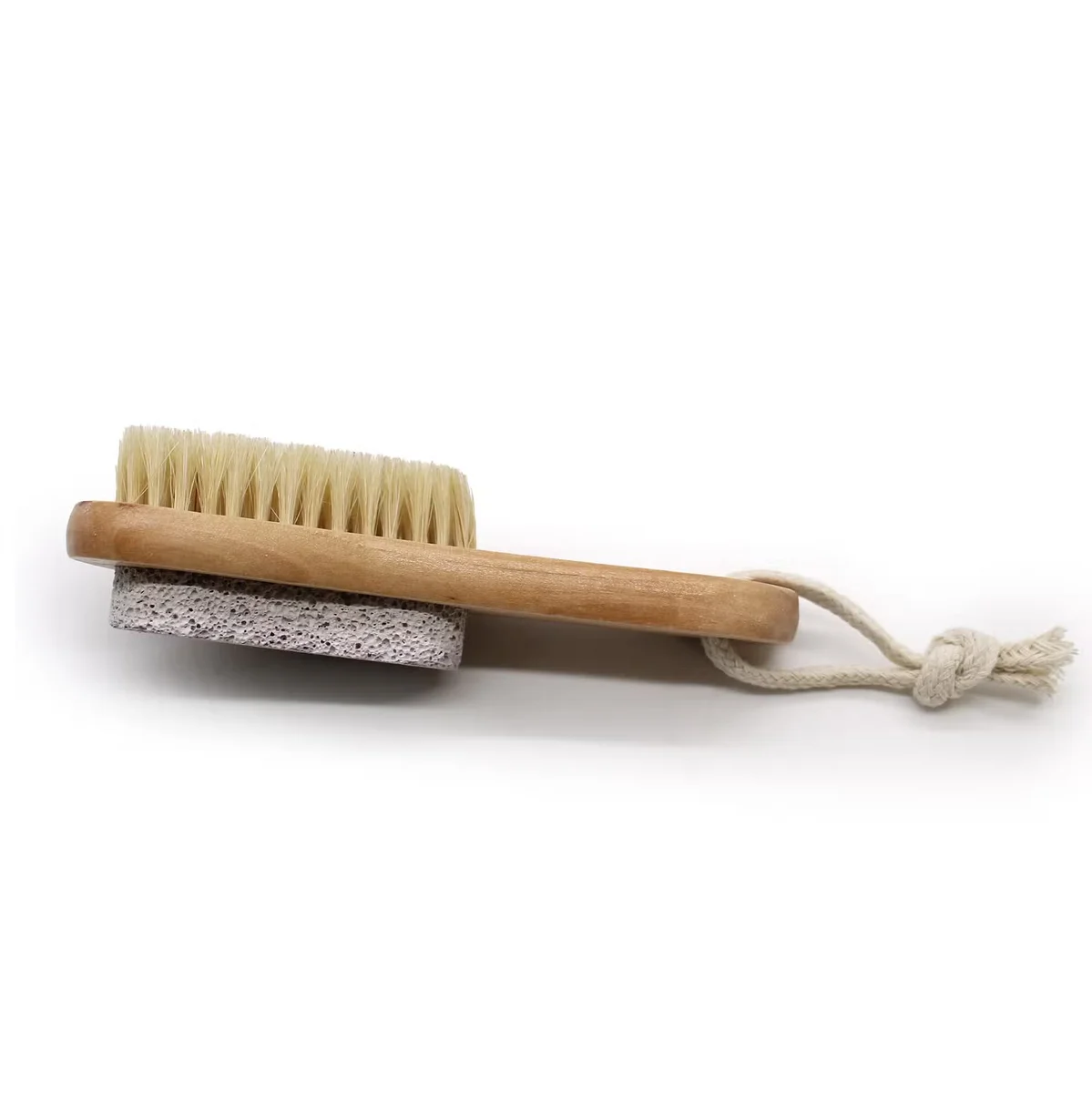 Pumice scrub brush with textured pumice tip and ergonomic handle.