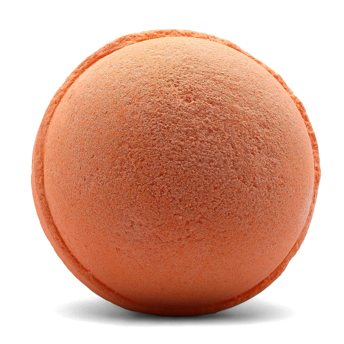 Set of three tangerine and grapefruit bath bombs displayed together.