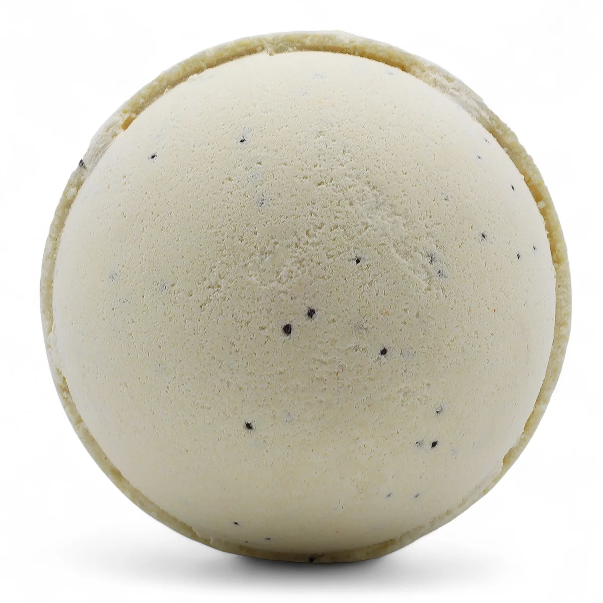 Three vanilla scented bath bombs in a small set poised on a bathroom countertop.