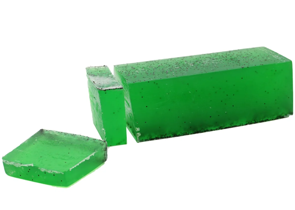 Loaf of tea tree mint soap in natural packaging.