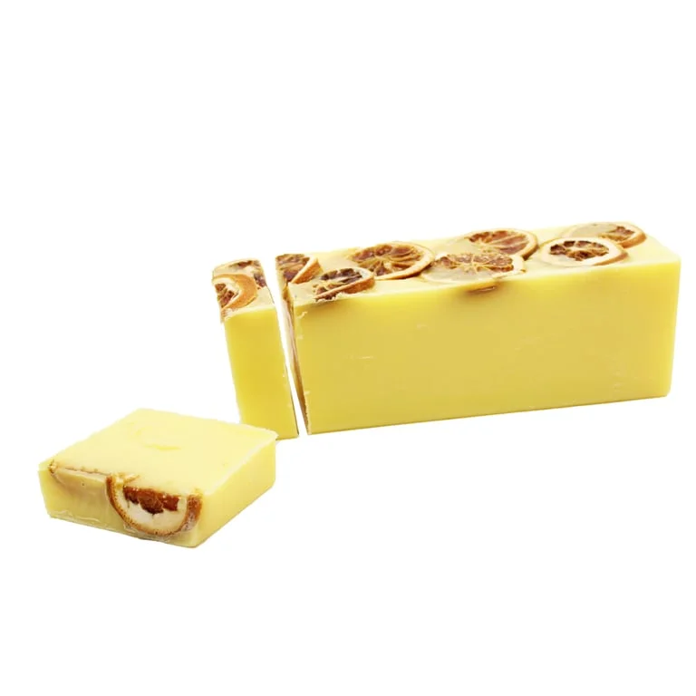 Slice of Sunshine soap loaf with a clean rectangular shape, resting on a plain background.