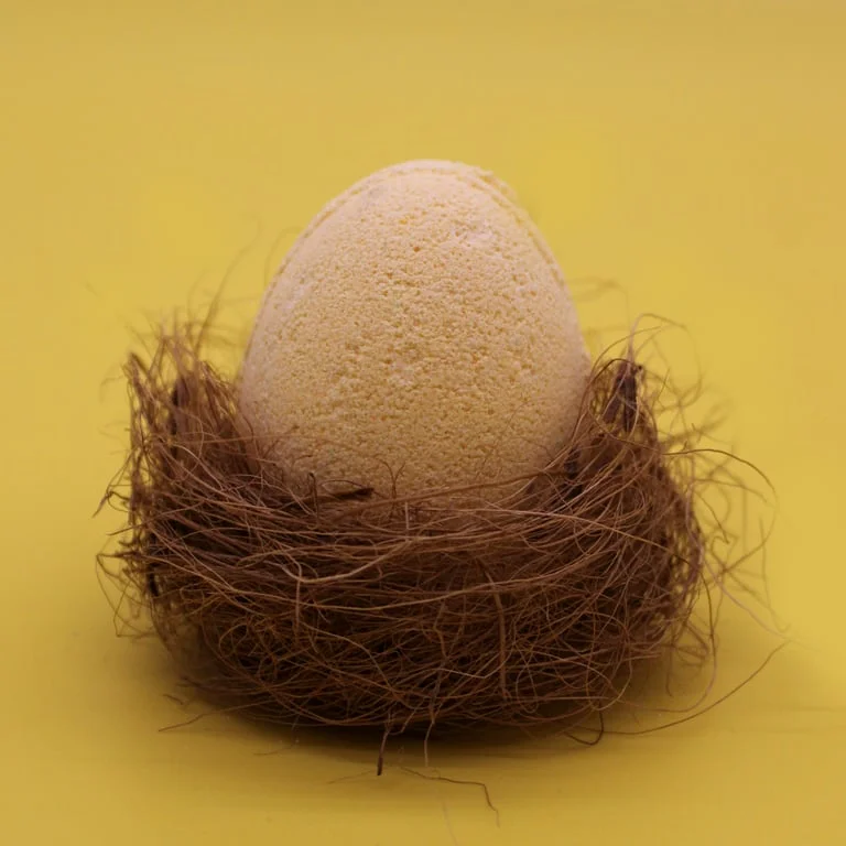 Tray of banana-shaped bath bombs in a tray, presented in a stylish, compact array