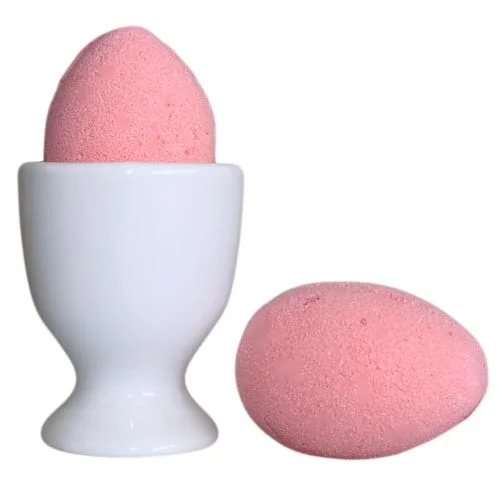 Cherry bath eggs tray containing pastel coloured egg-shaped bath bombs