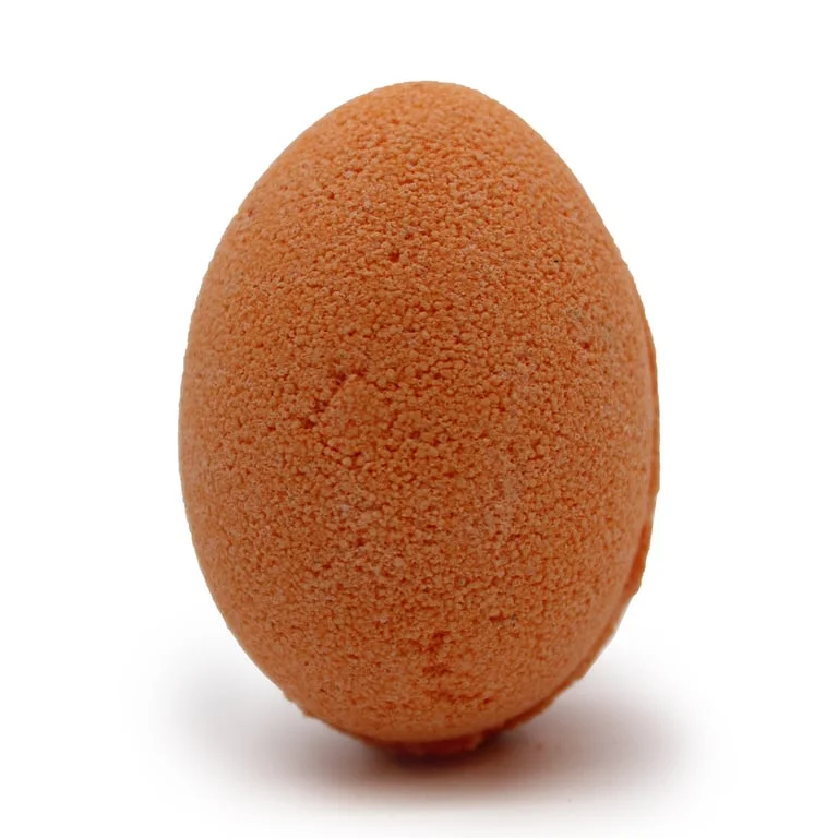 Tray of tangerine bath eggs with grapefruit colour, suitable for bath product