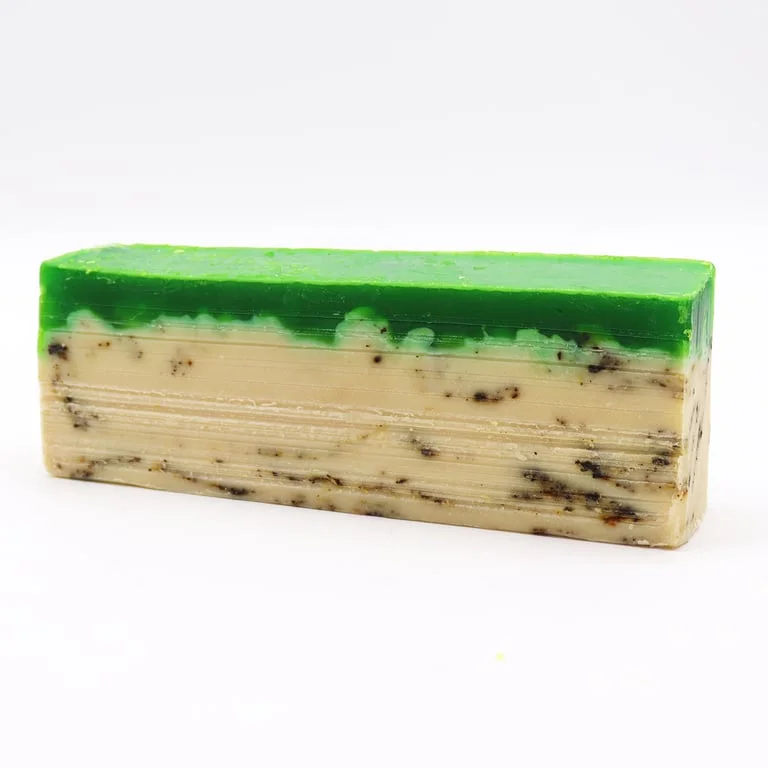 Loaf of green tea infused olive oil soap, fresh green hue, mottled texture, ready for use