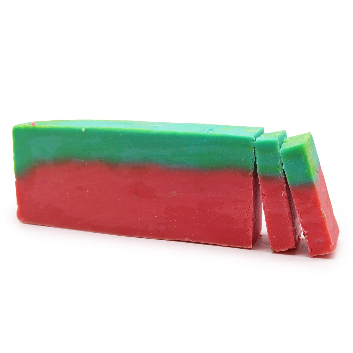 Watermelon olive oil soap loaf with green rind texture.