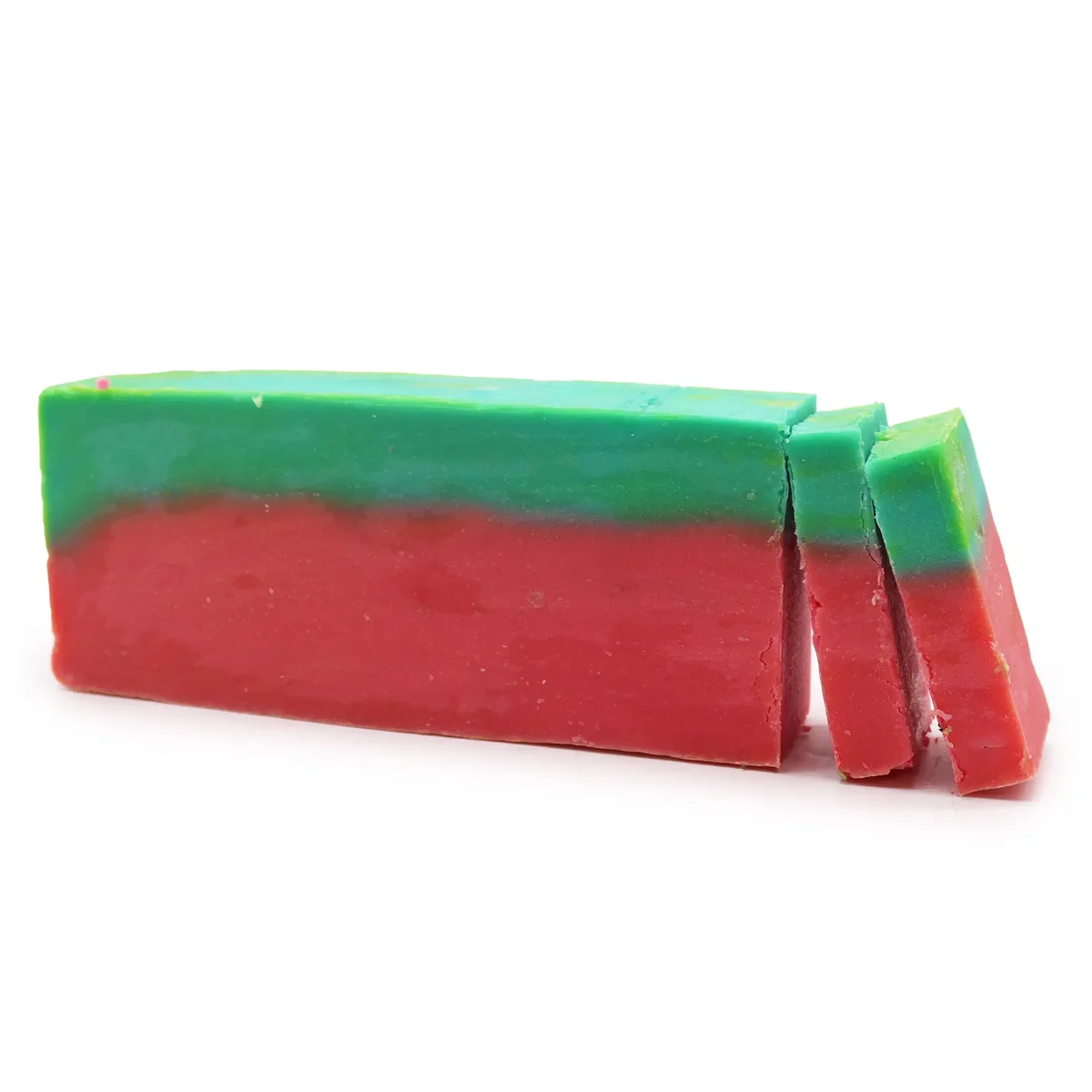Olive oil soap loaf resembling a watermelon, green rind with pink interior.