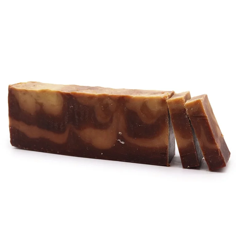 Loaf of vanilla olive oil soap with smooth pale yellow surface.
