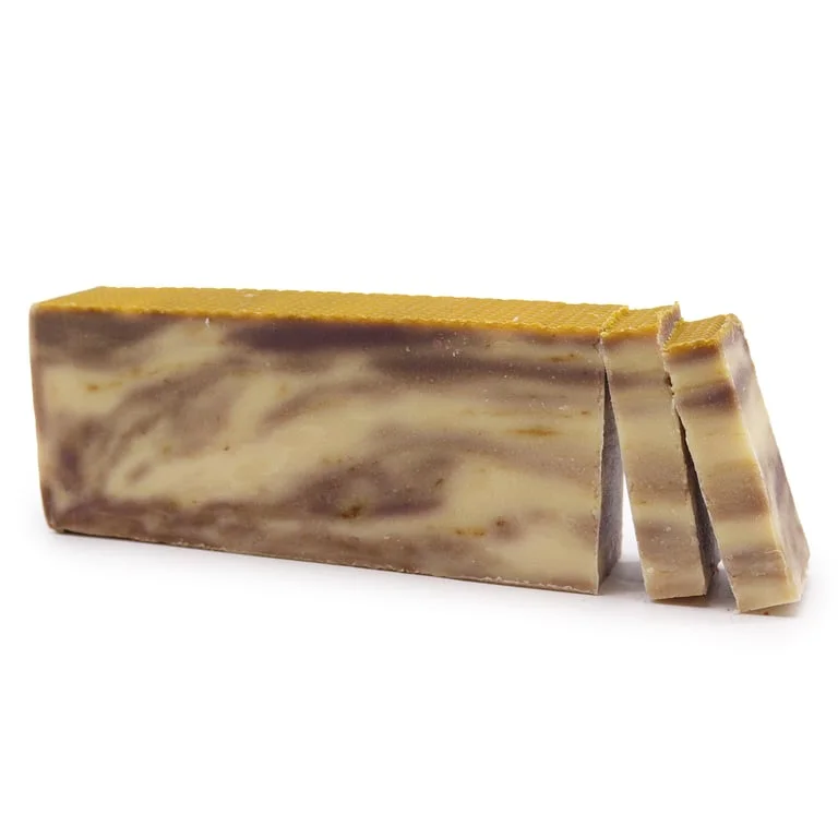 Loaf of propolis olive oil soap with a smooth brown surface.