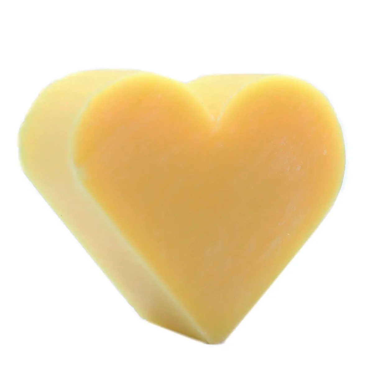 Heart guest soap shaped like a grapefruit, green fruit specks, bar soap in soft packaging.