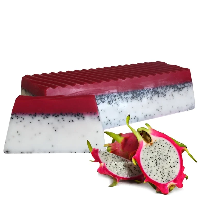 Glossy dragon fruit soap loaf with vibrant pink and green swirl, rectangular shape.