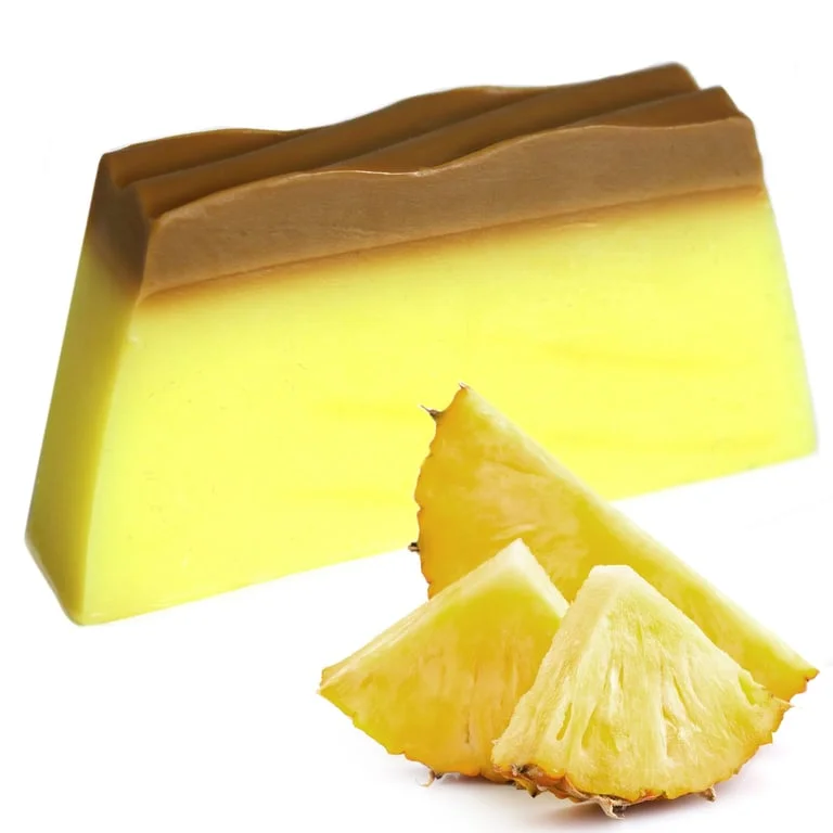 Tropical soap loaf featuring pineapple shape, bright yellow soap with green leaf accents.
