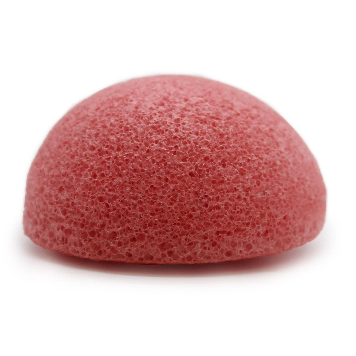 Rose coloured konjac facial sponge with a natural, pliable texture