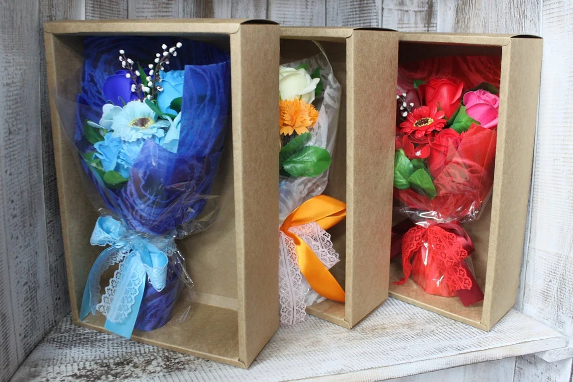 Colourful bouquet of red floral hand soap presented in a gift box