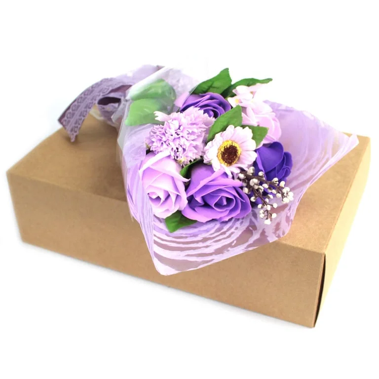 Purple hand soap bundled in a wrapped floral bouquet inside a decorative box